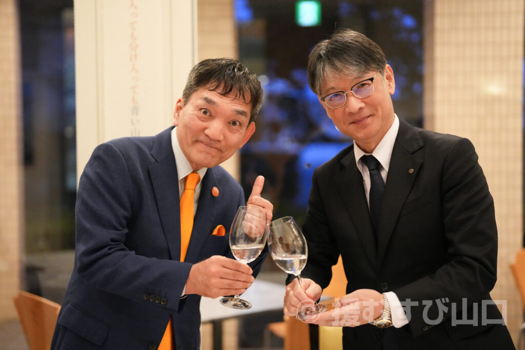 ①・援むすび山口・トライアングル・山口市・伊藤市長・新谷酒造・わかむすめ・セントコア山口・ヤスベェ・新井道子・まーちゃん・地域商社やまぐち株式会社